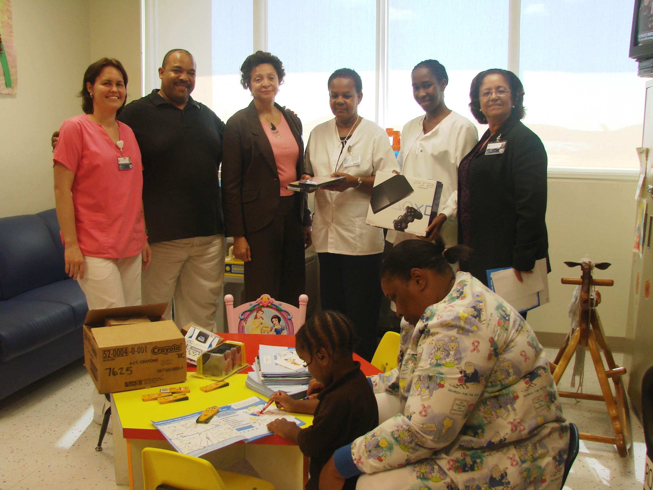 Pictured left to right: Jennifer Stefferson, R.N.; Thomas Boatwright, past president, Rotary Sunrise; Angela Rennalls-Atkinson, M.B.S., M.S.R.N., chief operating officer; Eunice Gumbs, R.N., clinical care coordinator;  Emily Eloi-Henderson, R.N., assistant head nurse for pediatrics; Elizabeth Harris, interim chief executive officer, RLSMC; Janice Lake, C.A.N.; and a little visitor to the Pediatric Unit..