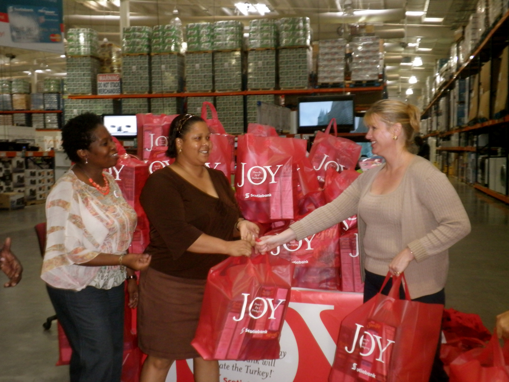 The Family Resource Center's Vivian St. Juste and Anya Stuart with Scotiabank's  Kelly Morgan (pictured from left) at Cost-U-Less.