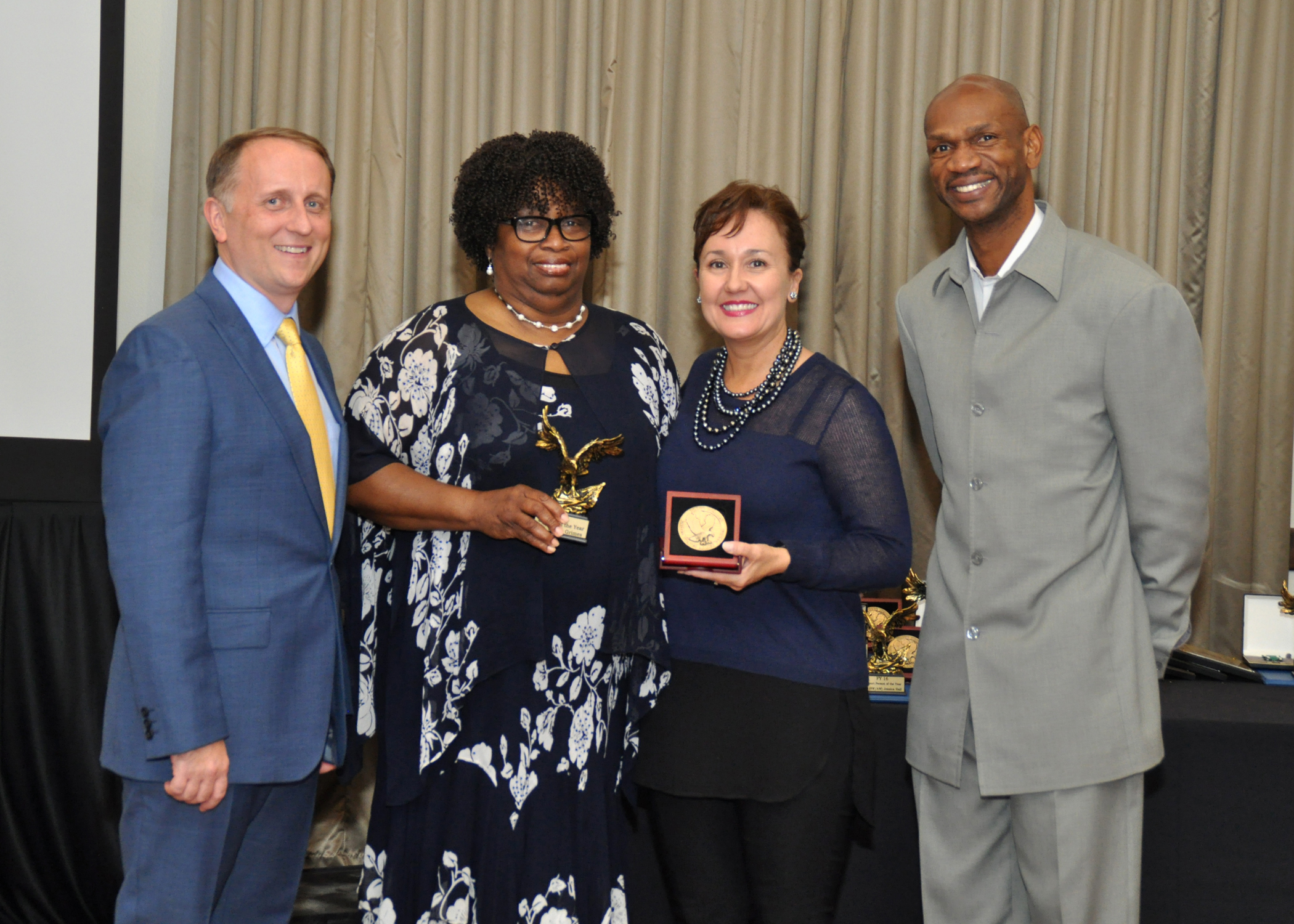St. Thomas native Mariel Grimes (second from left), an enlisted processing assistant assigned to Navy Recruiting District (NRD) San Antonio, was recognized as the NRD's Civilian of the Year for Fiscal Year 2016 during an awards banquet held in Texas  (U.S. Navy photo by Burrell Parmer, Navy Recruiting District San Antonio Public Affairs/Released)                    