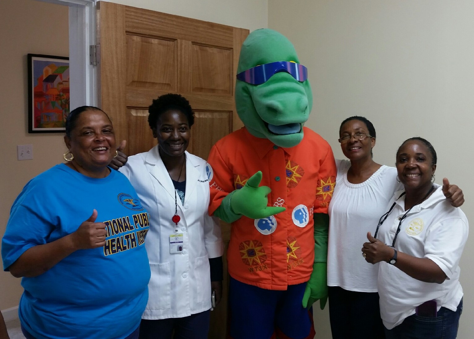 St. Thomas outreach workers with mascot