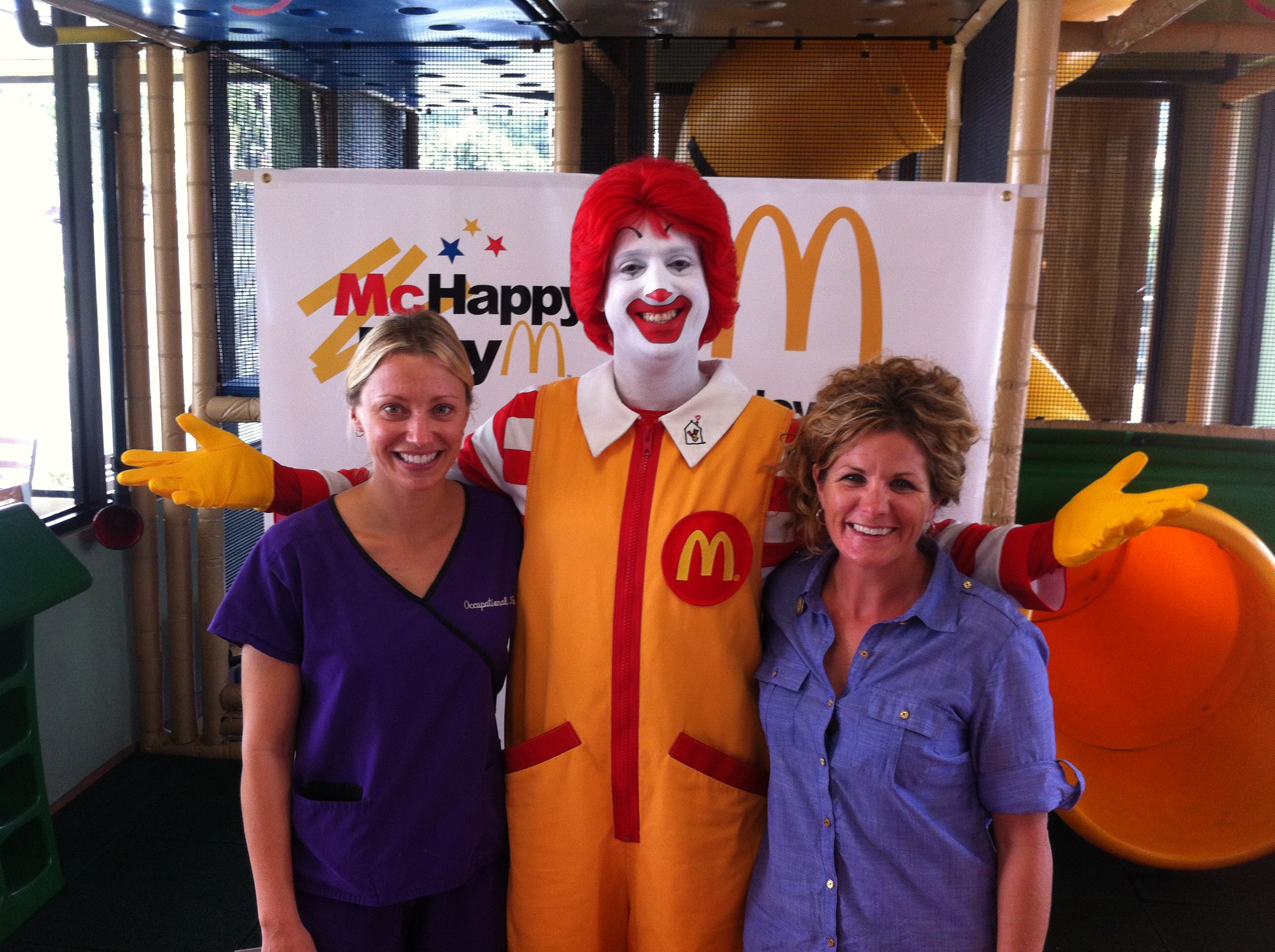 TADA Therapists Kelly Neevel and Lisa Parfitt celebrate the launch of the 2012 McHappy Day Campaign with Ronald McDonald who Kicks Off McHappy Day on St. Thomas