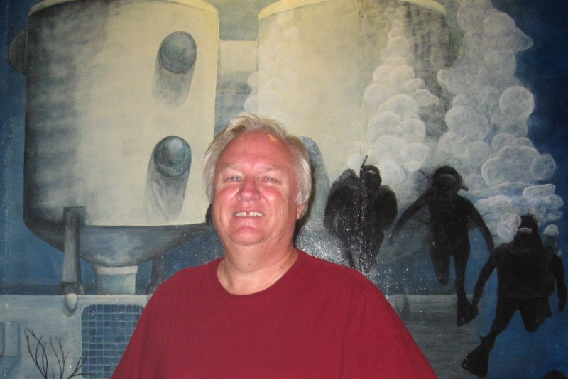 VIERS Administrator Randy Brown with a mural of the Tektite underwater habit.