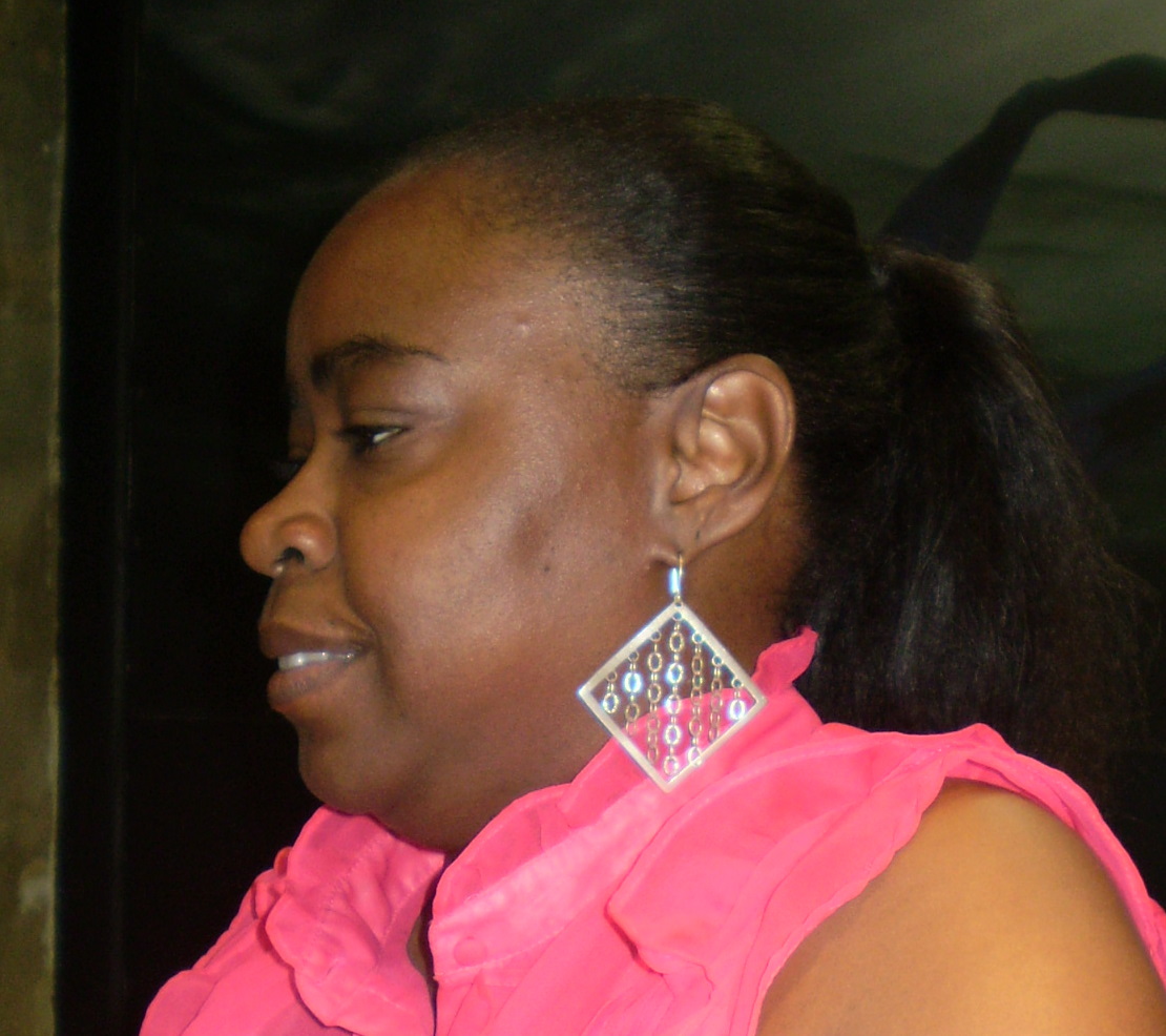 JCove employee Monique Thompson displays the stores sterling silver 'Acid Rain' earrings.