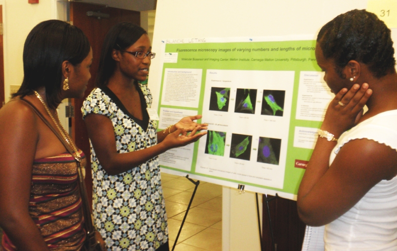 Blanche Letang explains her research to fellow students Brittani Stanley and Oonijah Thomas.