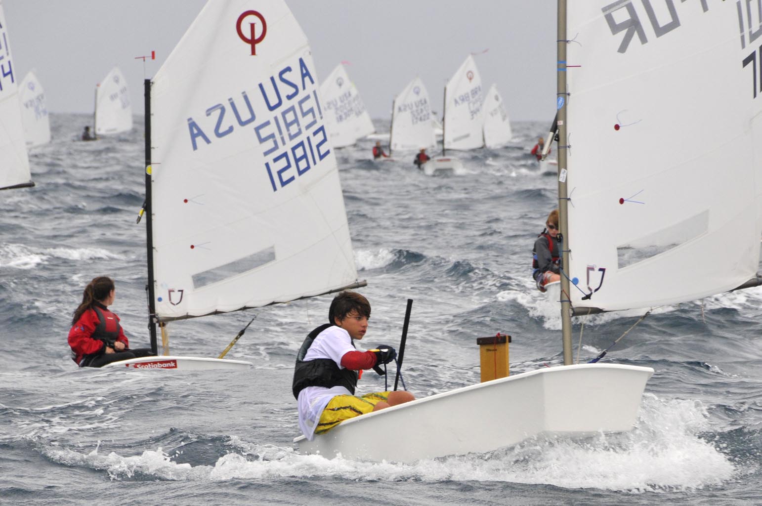 Photo: 2010 Scotiabank International Optimist Regatta Champion, Puerto Rico’s Jorge Gonzalez, leading the pack. Credit: Dean Barnes