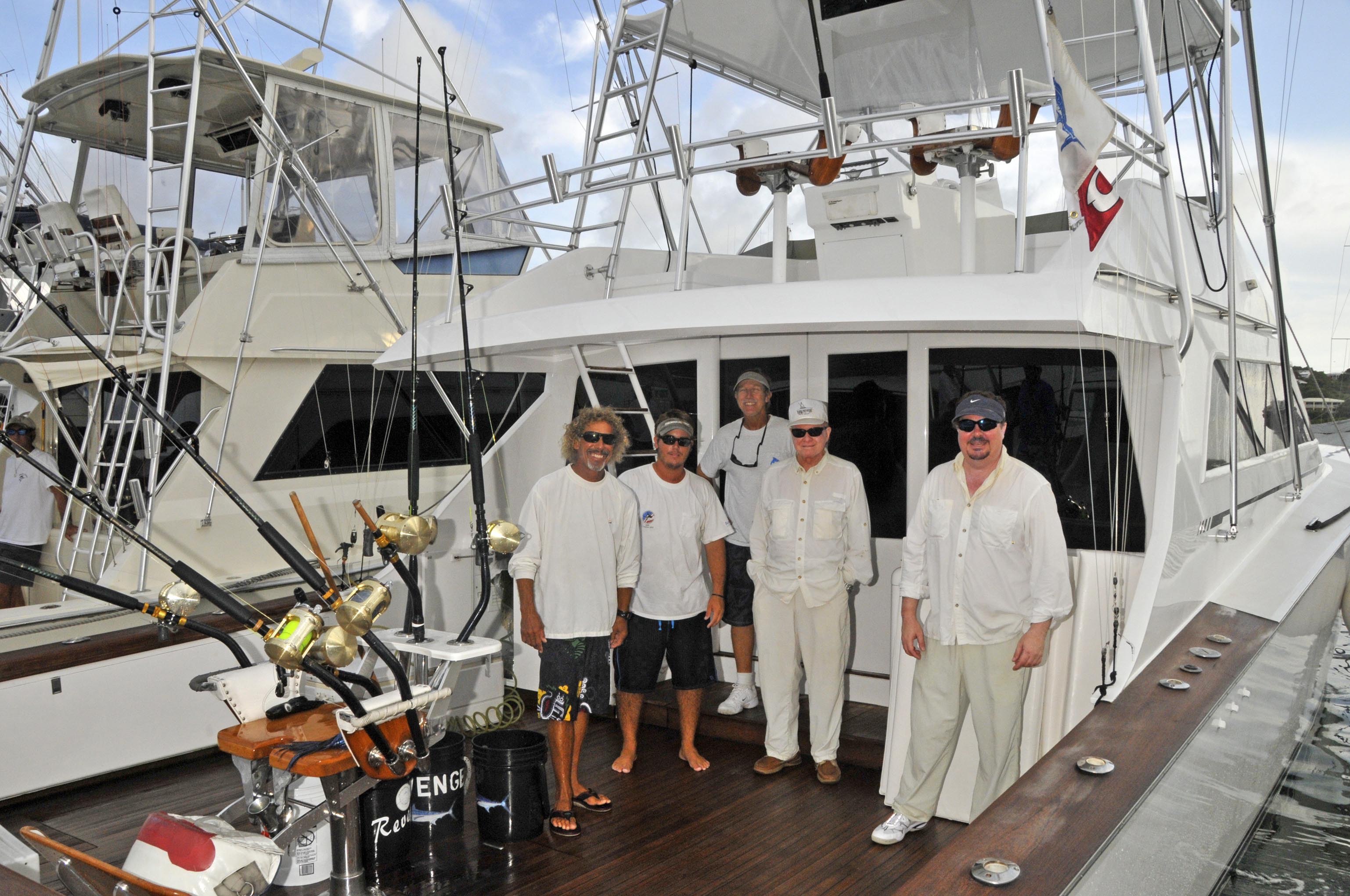 Photo: L to R: Mates Dean Dunham and Ryan Mertens, Capt. Mike Lemon, father-and-son anglers Sam Jennings and Jon Jennings.
