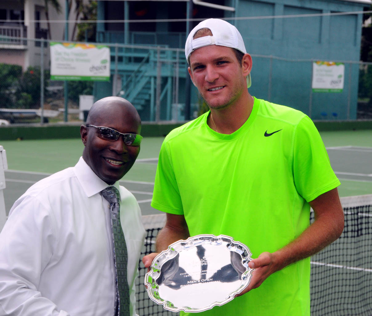  Choice Communications CEO and General Manager Tony Shepherd awards Men’s Open Singles winner Philip Bester.