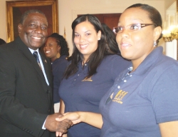 Lt. Gov. Gregory R. Francis, Michelle John-Baptiste (center) and Nadia Fearon.