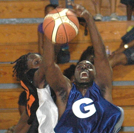 Jamal Hosier of Guidance battles for the rebound with Legacy's Kwame Dulleary.