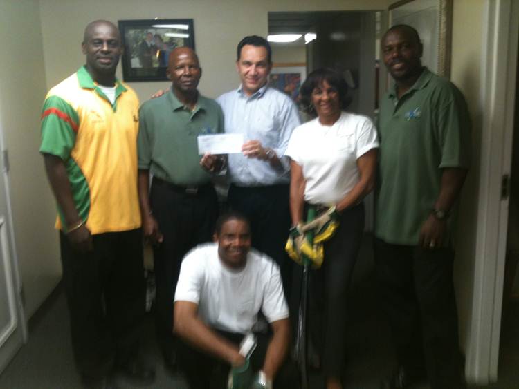 Pictured from left to right are: Hamish Anthony, team coach; Kenneth Allen, team founder and president; Gonzalez; Sharon Flamon, executive secretary to Gonzalez; Juneny Anthony, team captain; and Mardochee Pierre, team fan.