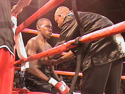 Julius Jackson takes a breather before getting back up to topple opponent Luis Hodge during Saturday's fights.