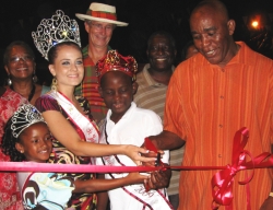 Cutting the ribbon to open the village (from left): Princess Daniela Joseph; Miss St. John, Lea Scott; Prince Davon Jackson Alfred; and James Penn.