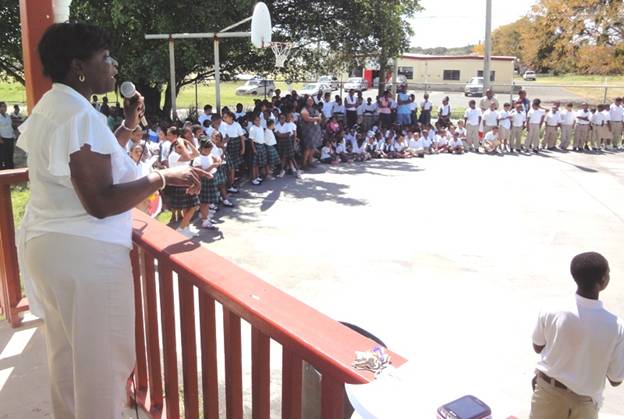 Lew Muckle School Assistant Principal Delicia Sealey-Espinosa rallies students on VITAL testing Tuesday at the school’s basketball court 