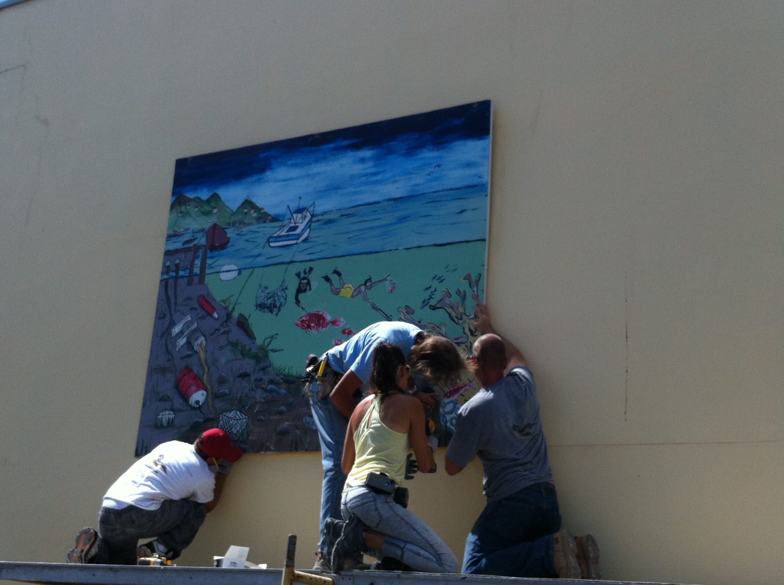 Students from St. Croix Educational Complex H.S. work on mural