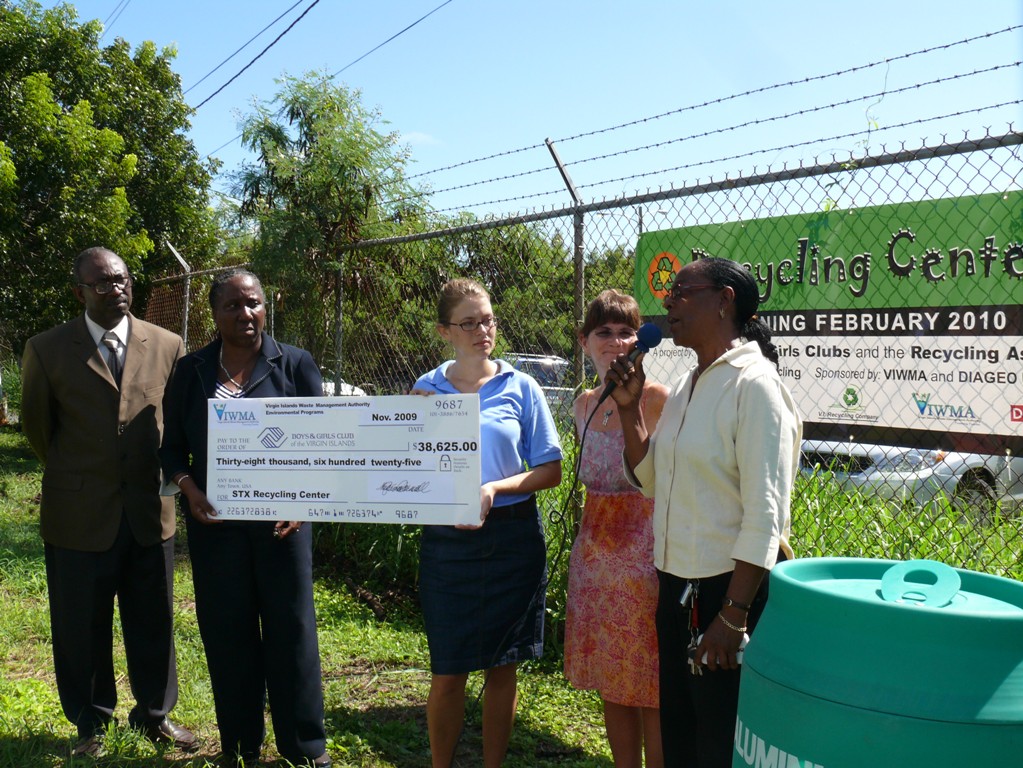 Boys and Girls Club representatives receive check from WMA officials during presentation ceremony Monday.