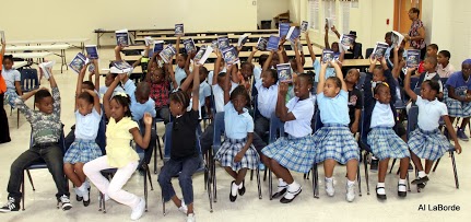 Lockhart Elementary 3rd graders showing everyone their new dictionaries. (photo by Rotarian Alphonso LaBorde)