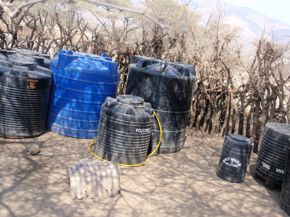 These cisterns, kept behind a locked wooden fence,must serve the needs of 125 villagers.