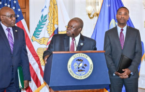 Gov. Kenneth Mapp, center, flanked by IRB Director Marvin Pickering, left, and Attorney General Claude Walker at Wednesday's press conference (Photo provided by Government House)