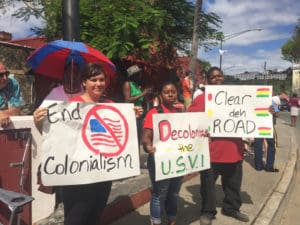 From left, Savannah Loftus, Hadiya Sewer and, T’Sean Brady members of the V.I. Youth Advocacy Coalition, call for Virgin Islanders to fight against the territory’s current political status.