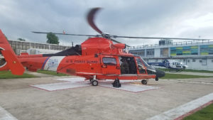 An MH-65 Dolphin helicopter from Coast Guard Air Station Borinquen medivaced a patient from Celebrity Reflection to a hospital in San Juan. (Coast Guard photo)