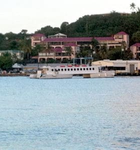 The ferry QE IV glides into Gallows Bay Wednesday night.