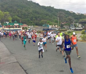 Runners take off from the starting line in Havensight mall on St. Thomas.