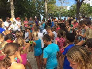 Running coach Therese Hodge welcomes participants and gets them ready for a warm-up.