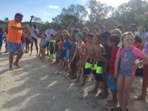 Swimmers in the five to eight age group get ready to start.