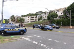 Police gather around the scene of Thursday's shooting.