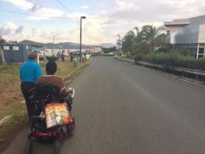 Getting around St. Thomas is difficult for Javanka Larcheveaux on her motorized wheelchair, since sidewalks are lacking and streets are unmarked. 