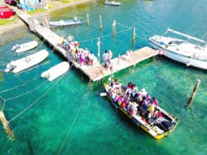 A boatload of volunteers arrive at the Hassel Island dock for Saturday's cleanup. (Photo provided by Kai Frett)