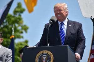 President Donald Trump addresses a crowd.