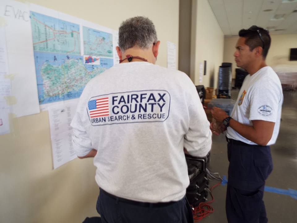 Unidentified members of FEMA search and rescue team members from Virginia making plans while inspecting a map of St. Croix (Photos courtesy of the V.I. National G