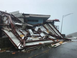 Volunteers and rescue personnel are working side by side to clean up the damage on St. John, but there's a long way to go, they agree. (David Knight photo)