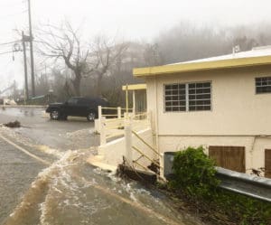 Water cascades through the Four Corners intersection on St. Thomas's north side. (James Gardner photo)