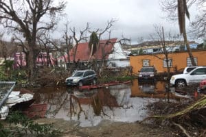 In the weeks after Hurricanes Irma and Maria hit, the Slim Mans parking lot in Cruz Bay shows the effects of Hurricane Maria. (Amy Roberts photo)