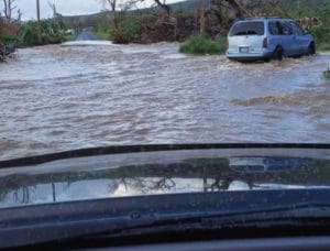 A sudden severe downpour caused flooding over St. Croix's La Grange Road Oct. 12. (Photo from Lynette Johannes's Facebook page)