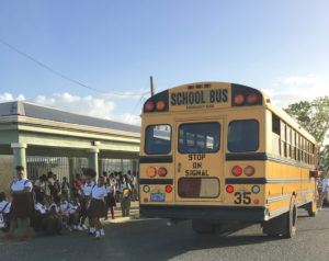 Students unload from the school bus Monday at St. Croix Central High School.