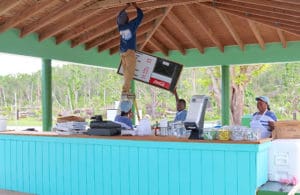 Magens Bay employees work to set up the concession stand for hungry visitors.