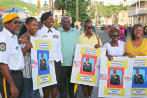 Gov. Kenneth Mapp and members of the Charlotte Amalie High School Class of 1983 honor Saturday’s Parade Grand Marshal Laurel Francis, seen standing to the left of Mapp.