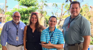 FEMA public information officers, from left, Manuel Broussard, Eric Adams and Bruce Bouch with Rachel Rochfal of the St. John Community Foundation.