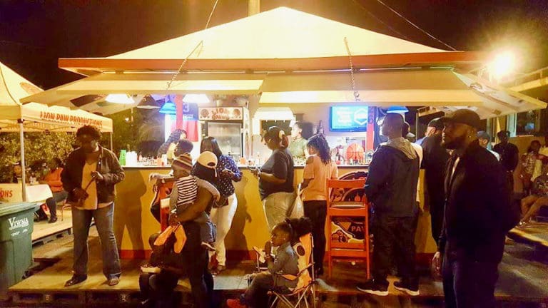 Families and friends gather at the Festival Village's booths for the kind of food you can only get at festival. (From Crucian Christmas Festival's Facebook page)