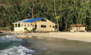 Oppenheimer Beach house, once surrounded by vegetation, now stands exposed on the beach. (Photo by Eleanor Gibney)