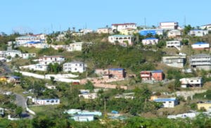 Blue tarps covering damaged roofs dot the landscape of Estate Tutu on St. Thomas in March 2018. Many V.I. homes like this were damaged in the hurricanes of 2017. Some of them are being repaired with the help of FEMA funding. (Bill Kossler photo)