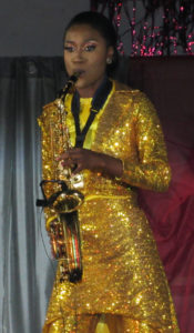 Jahnique Francis plays saxophone in the talent segment.