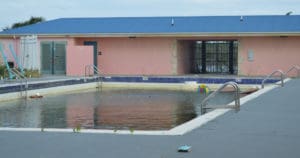 HUD funding may help replace some public buildings, potentially including the Frederiksted Pool at Vincent F. Mason Coral Resort, now abandoned and badly damaged. (Bill Kossler photo)