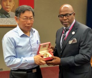 Sen. Myron Jackson presents a V.I. centennial clock to the mayor of Taipei.