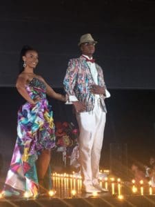 A couple dressed in color-coordinated designs from Posh Boutique.