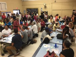 The cafeteria of the Julius E. Sprauve School fills up with St. John residents for the meeting of the Recovery and Resilience Task Force.