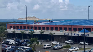 Workers repair the roof of the Cyril E. King Airport. (VIPA photo)